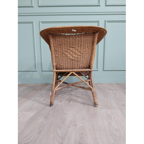 891 - 1950s wicker chair with cushion {73 cm H x 64 cm W x 64 cm D}.