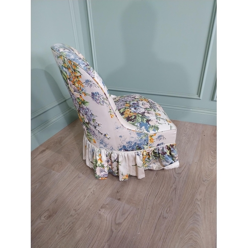 896 - Edwardian floral upholstered nursing chair raised on turned legs {77 cm H x 58 cm W x 61 cm D}.