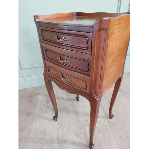 903 - Edwardian French mahogany bedside locker with three drawers raised on cabriole legs {73 cm H x 36 cm... 