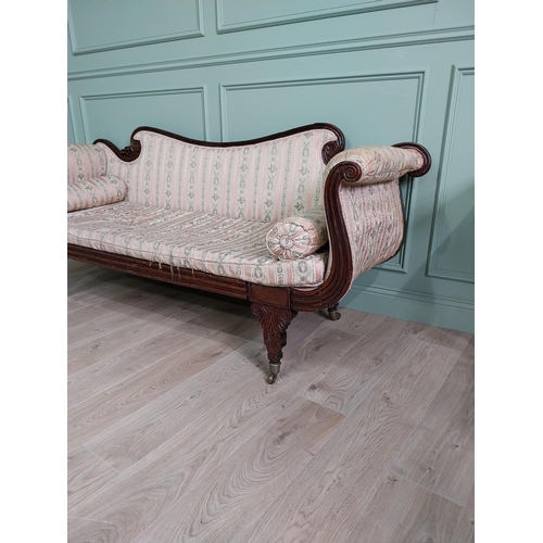 910 - Regency mahogany and upholstered sofa raised on turned legs and castors {89 cm H x 210 cm W x 70 cm ... 