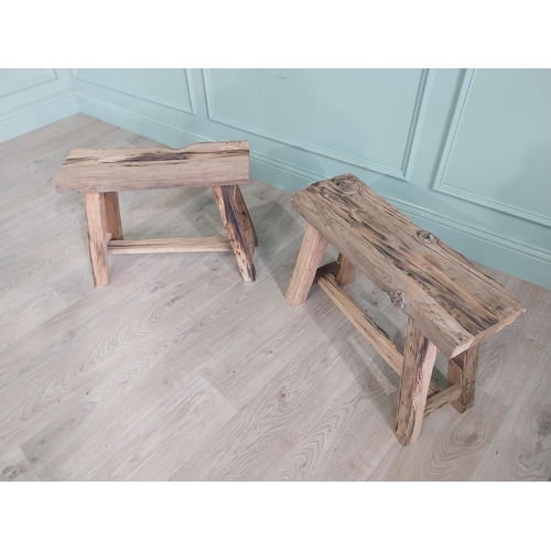 912 - Pair of vintage rustic oak stools raised on splayed legs {48 cm H x 61 cm W x 26 cm D}.