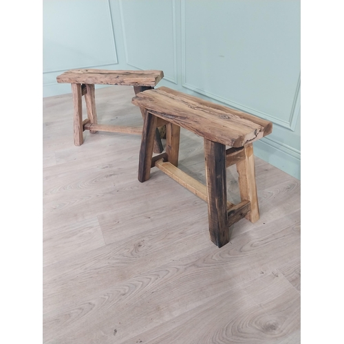 913 - Pair of vintage rustic oak stools raised on splayed legs {48 cm H x 61 cm W x 26 cm D}.