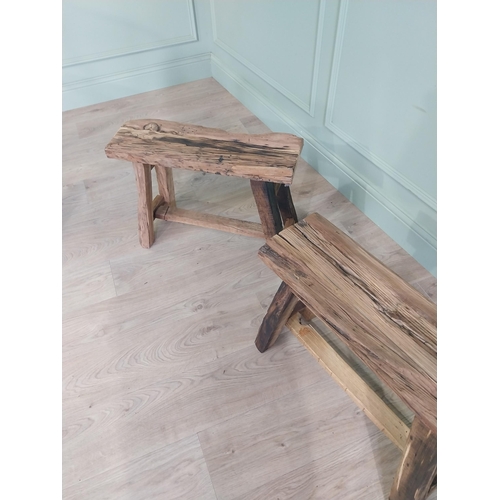 913 - Pair of vintage rustic oak stools raised on splayed legs {48 cm H x 61 cm W x 26 cm D}.