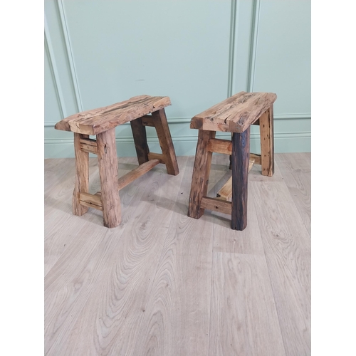 913 - Pair of vintage rustic oak stools raised on splayed legs {48 cm H x 61 cm W x 26 cm D}.