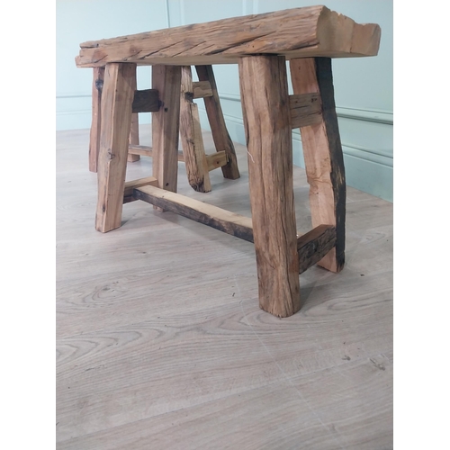 914 - Pair of vintage rustic oak stools raised on splayed legs {48 cm H x 61 cm W x 26 cm D}.