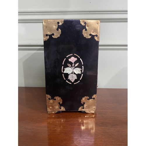 921 - Oriental ebonised and mother of pearl jewellery cabinet {24 cm H x 18 cm W x 15 cm D}.