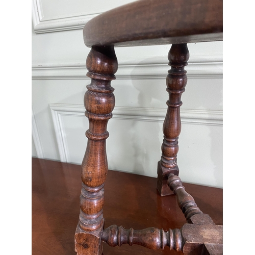 923 - Early 20th C. oak stool raised on turned legs and cross stretchers {40 cm H x 40 cm W x 30 cm D}.