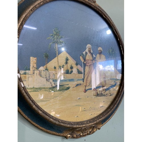 937 - Pair of early 20th C. Arabian scenes coloured prints mounted in painted and giltwood frames {46 cm D... 