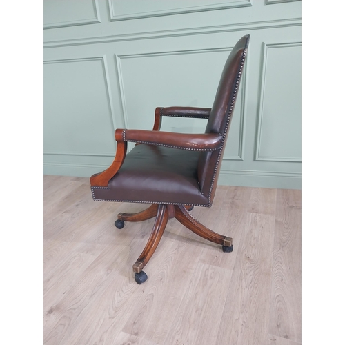 938 - Good quality mahogany and leather upholstered revolving office chair in the Georgian style {109 cm H... 