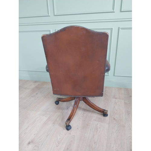 938 - Good quality mahogany and leather upholstered revolving office chair in the Georgian style {109 cm H... 