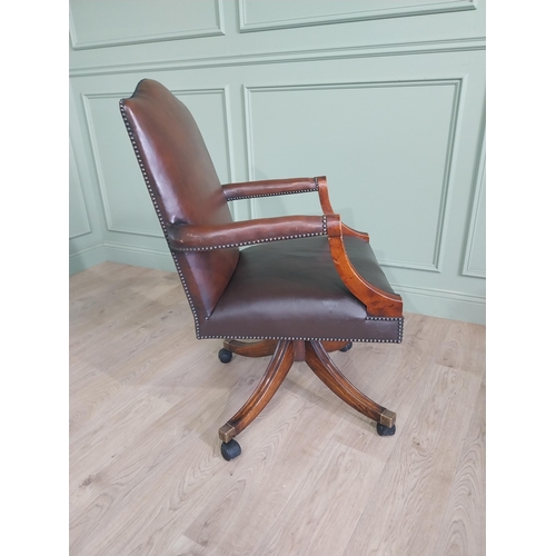 938 - Good quality mahogany and leather upholstered revolving office chair in the Georgian style {109 cm H... 