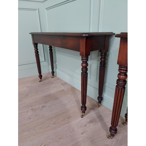 942 - Pair of good quality 19th C. mahogany side tables raised on reeded legs and brass castors {75 cm H x... 