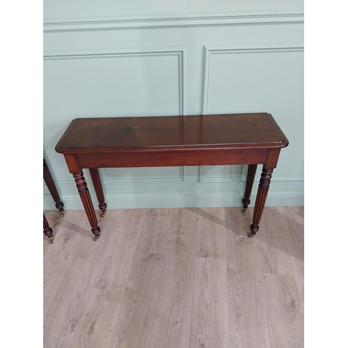 942 - Pair of good quality 19th C. mahogany side tables raised on reeded legs and brass castors {75 cm H x... 