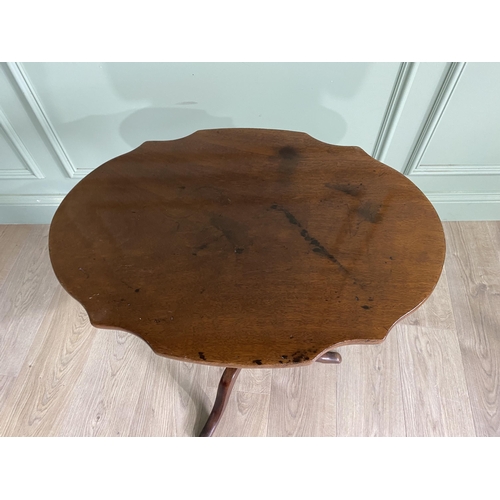 948 - Victorian mahogany shaped top wine table raised on turned column and three out swept legs {68 cm H x... 