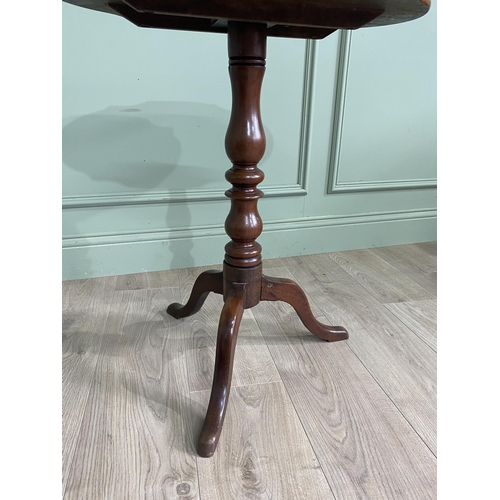 948 - Victorian mahogany shaped top wine table raised on turned column and three out swept legs {68 cm H x... 