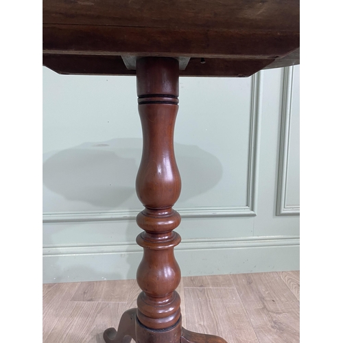 948 - Victorian mahogany shaped top wine table raised on turned column and three out swept legs {68 cm H x... 