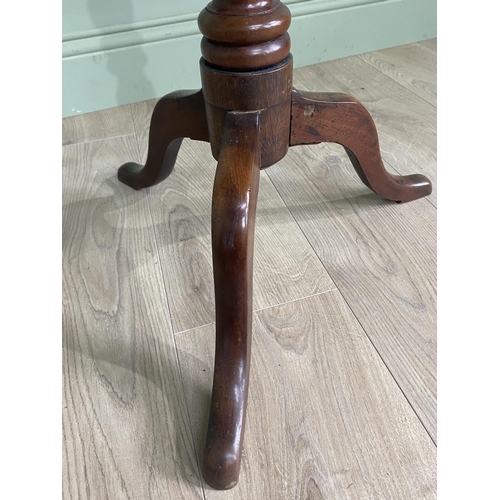 948 - Victorian mahogany shaped top wine table raised on turned column and three out swept legs {68 cm H x... 