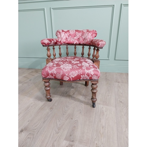 956 - Victorian mahogany and upholstered armchair raised on turned legs and brass castors {73 cm H x 67 cm... 