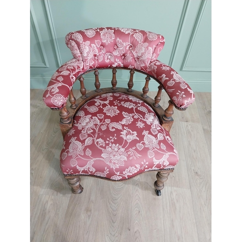 956 - Victorian mahogany and upholstered armchair raised on turned legs and brass castors {73 cm H x 67 cm... 