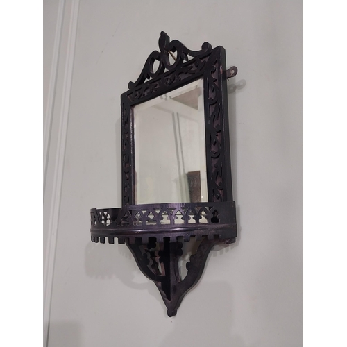 968 - Edwardian ebonised wall mirror with shelf {50 cm H x 24 cm W x 14 cm D}.