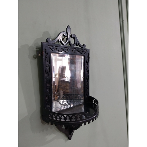 968 - Edwardian ebonised wall mirror with shelf {50 cm H x 24 cm W x 14 cm D}.