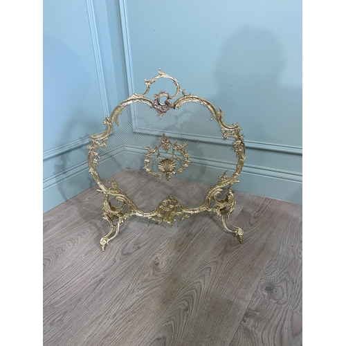 97 - Good quality decorative gilded brass fire screen in the Rocco style {60 cm H x 56 cm W x 20 cm D}.