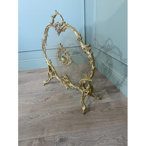 97 - Good quality decorative gilded brass fire screen in the Rocco style {60 cm H x 56 cm W x 20 cm D}.