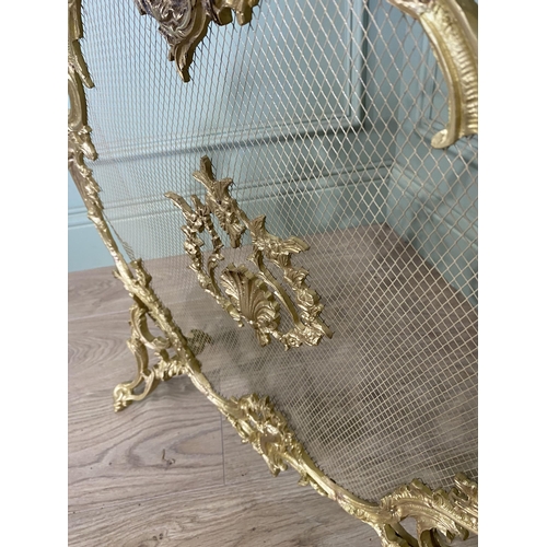 97 - Good quality decorative gilded brass fire screen in the Rocco style {60 cm H x 56 cm W x 20 cm D}.