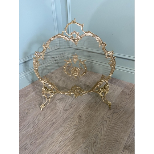 97 - Good quality decorative gilded brass fire screen in the Rocco style {60 cm H x 56 cm W x 20 cm D}.