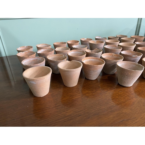 973 - Collection of thirty five early 20th C. terracotta plant seed pots {6 cm H x 7 cm Dia.}.