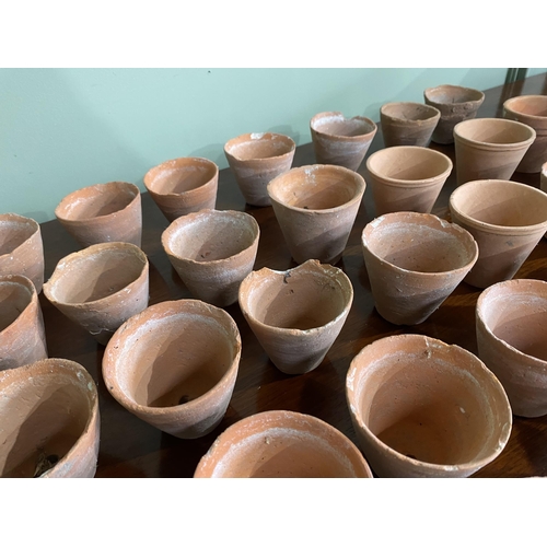 973 - Collection of thirty five early 20th C. terracotta plant seed pots {6 cm H x 7 cm Dia.}.