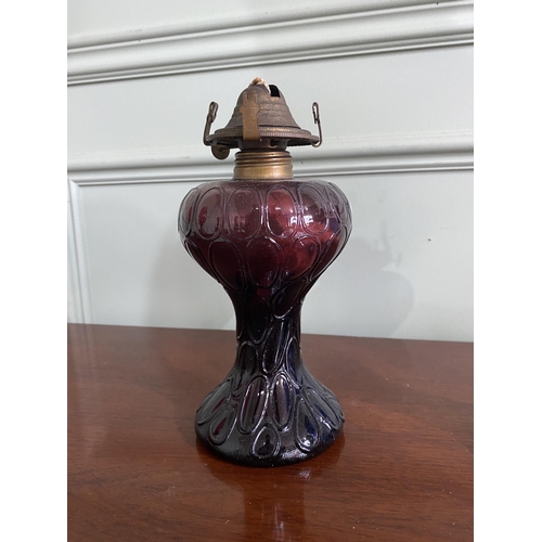 982 - Two early 20th C. coloured glass oil lamps with brass burners {22 cm H x 11 cm Dia.}.