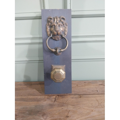 986 - Early 20th C. brass knocker and door pull mounted on pine plinth {44 cm H x 15 cm W x 10 cm D}.