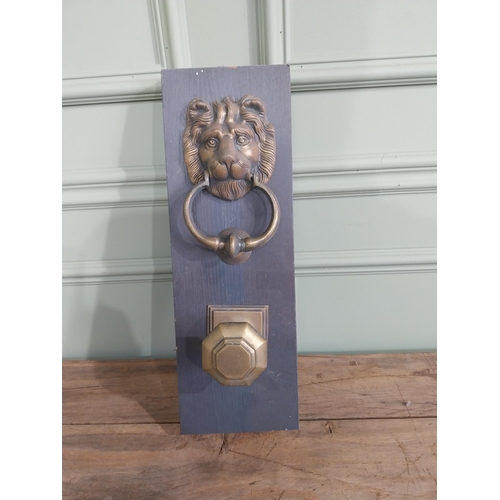 986 - Early 20th C. brass knocker and door pull mounted on pine plinth {44 cm H x 15 cm W x 10 cm D}.