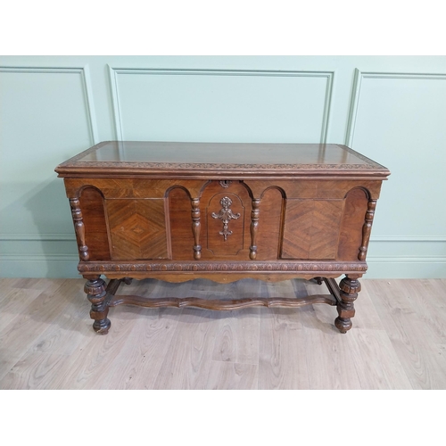 989 - Edwardian walnut blanket box raised on turned legs and single stretcher in the Tudor style {76 cm H ... 