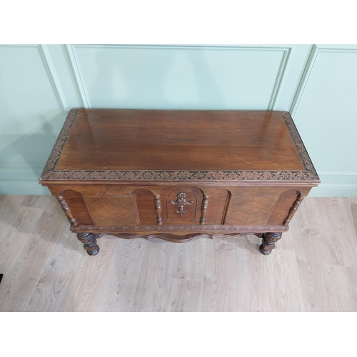 989 - Edwardian walnut blanket box raised on turned legs and single stretcher in the Tudor style {76 cm H ... 