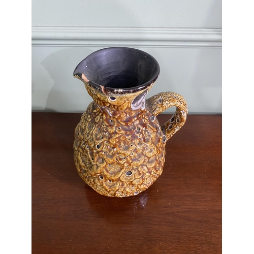 993 - Mid-century West German pottery jug with some damage {25 cm H x 18 cm W x 17 cm D}.