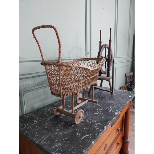 998 - Early 20th C. wicker child's pram and walnut spinning wheel {63 cm H x 65 cm W x 36 cm D and 75 cm H... 