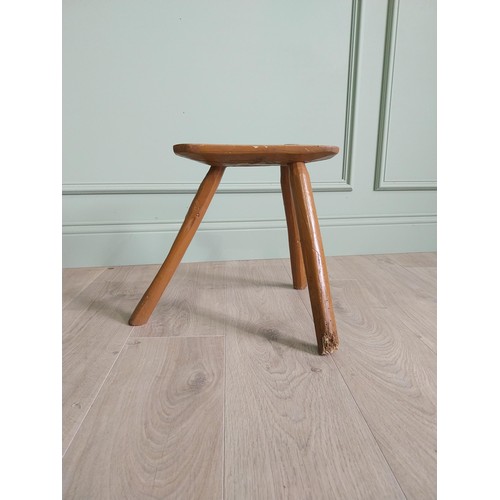 1204 - 19th C. Irish painted elm three legged stool {36 cm H x 40 cm W x 36 cm D}.