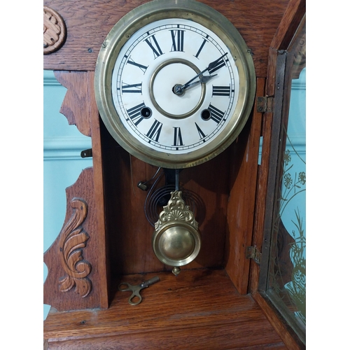 2028 - Early 20th C. oak gingerbread clock. {60 cm H x 37 cm W x 14 cm D}.