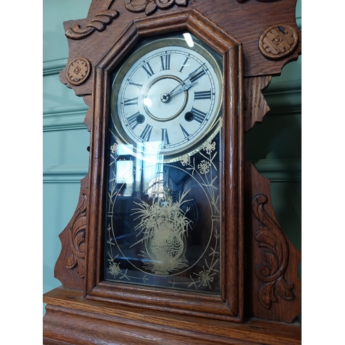 2028 - Early 20th C. oak gingerbread clock. {60 cm H x 37 cm W x 14 cm D}.