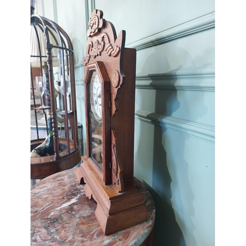 2028 - Early 20th C. oak gingerbread clock. {60 cm H x 37 cm W x 14 cm D}.