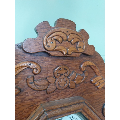 2028 - Early 20th C. oak gingerbread clock. {60 cm H x 37 cm W x 14 cm D}.