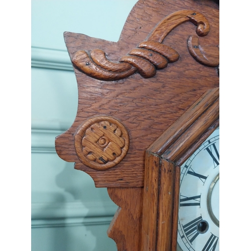 2028 - Early 20th C. oak gingerbread clock. {60 cm H x 37 cm W x 14 cm D}.