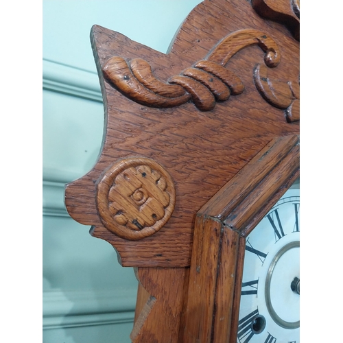 2028 - Early 20th C. oak gingerbread clock. {60 cm H x 37 cm W x 14 cm D}.