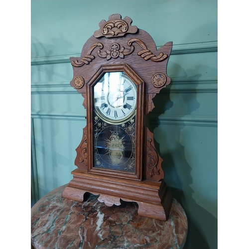 2028 - Early 20th C. oak gingerbread clock. {60 cm H x 37 cm W x 14 cm D}.