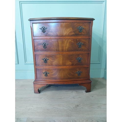 2031 - Mahogany bow fronted chest of drawers with four drawers raised on bracket feet. {77 cm H x 66 cm W x... 