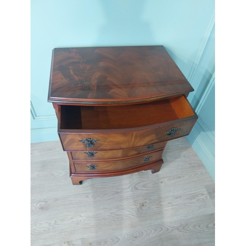 2031 - Mahogany bow fronted chest of drawers with four drawers raised on bracket feet. {77 cm H x 66 cm W x... 