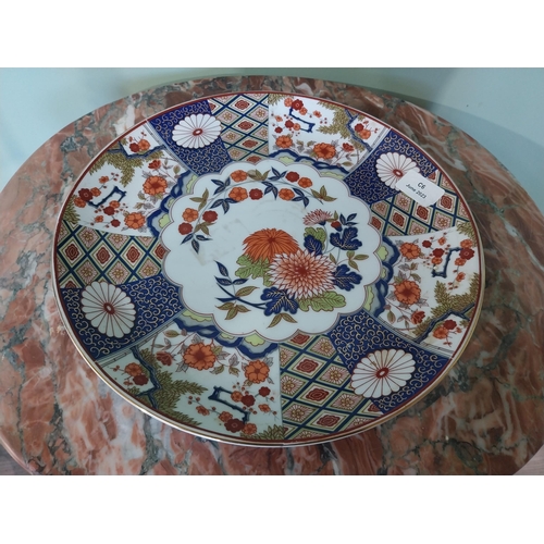 2034 - Oriental ceramic plate with floral design {31 cm Dia.}.