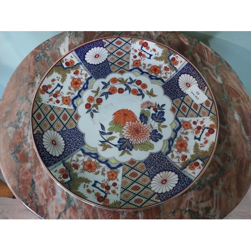 2034 - Oriental ceramic plate with floral design {31 cm Dia.}.